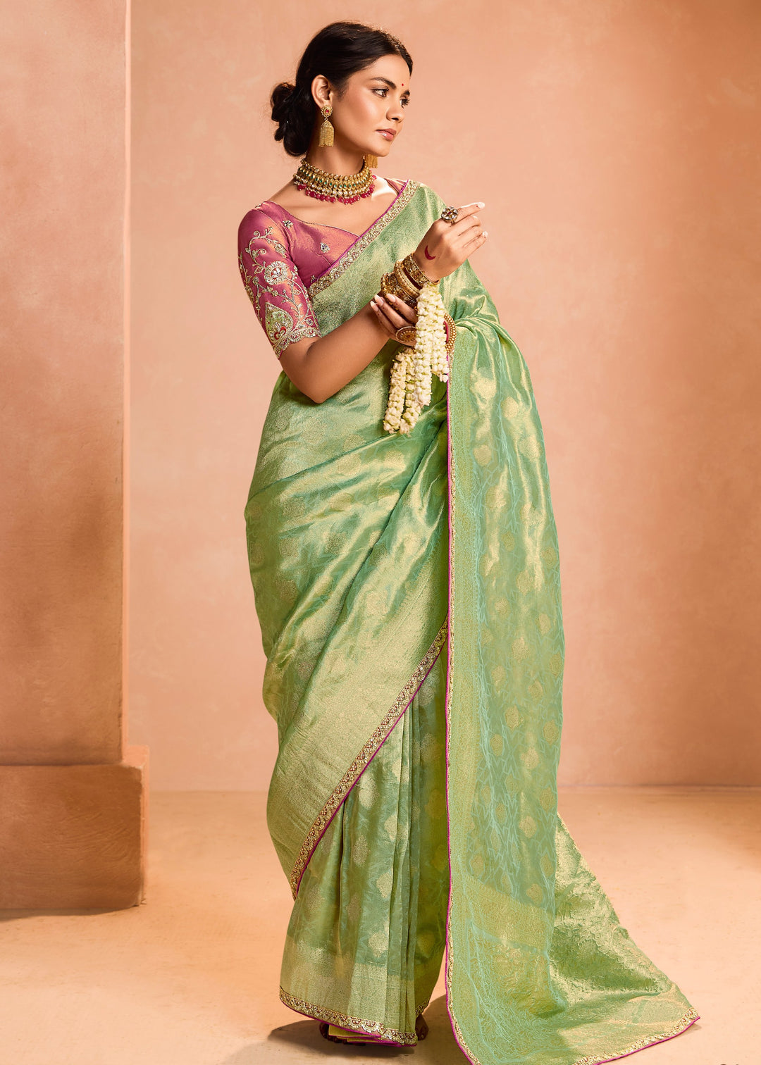 Pastel Green Zari Tissue Silk Saree With Weaving Work And Heavy Embroidery Lace