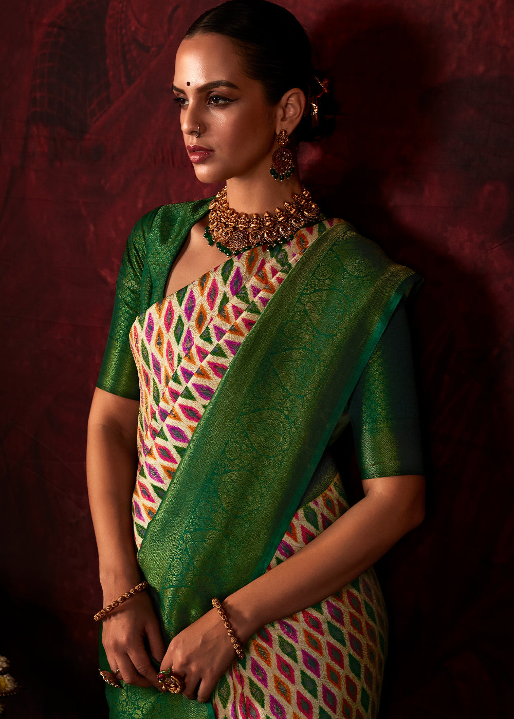 Green & White Patola Printed Silk Saree with Contrast Blouse