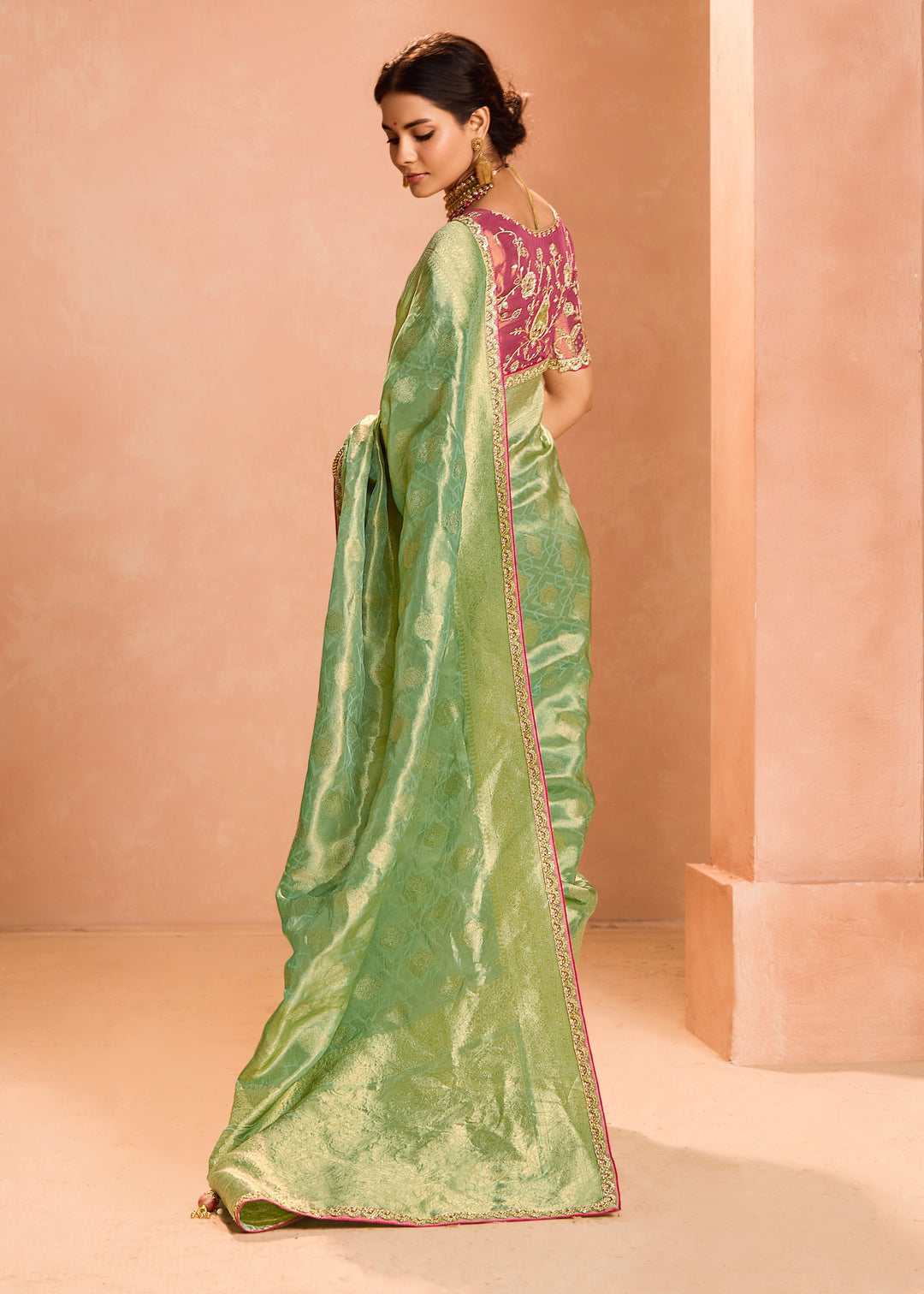 Pastel Green Zari Tissue Silk Saree With Weaving Work And Heavy Embroidery Lace