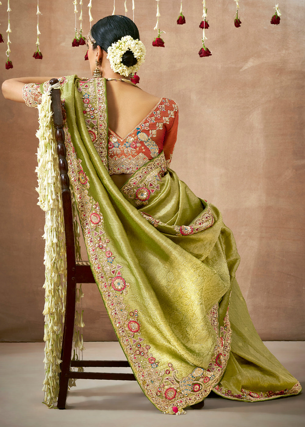 Pistachio Green Zari Woven Tissue Dola Silk Saree having Sequence, Pearl, Mirror & Thread Work: Festival Edition