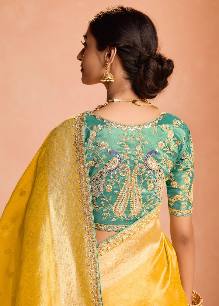 Butter Yellow Zari Tissue Silk Saree With Weaving Work And Heavy Embroidery Lace