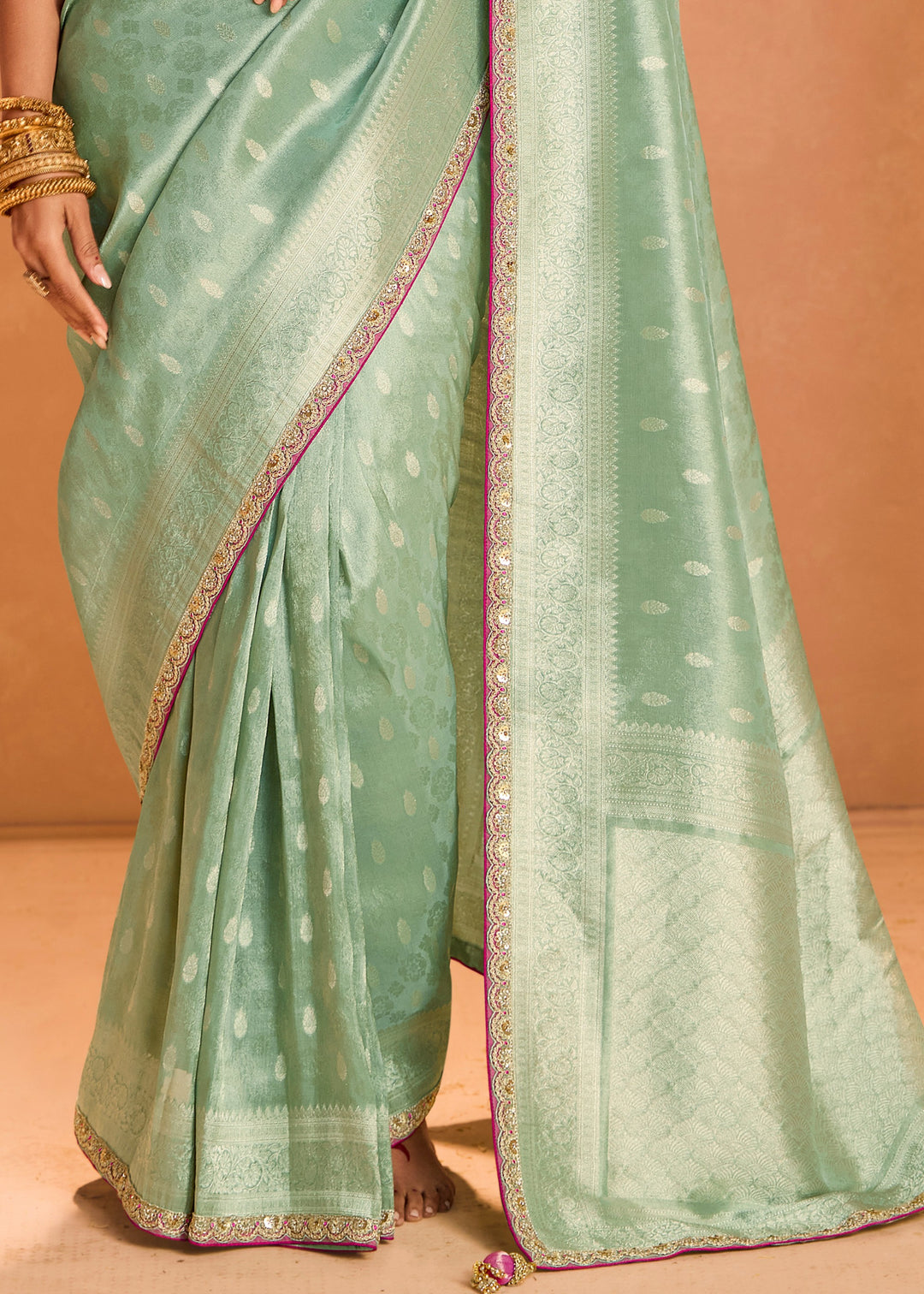 Mint Green Zari Tissue Silk Saree With Weaving Work And Heavy Embroidery Lace