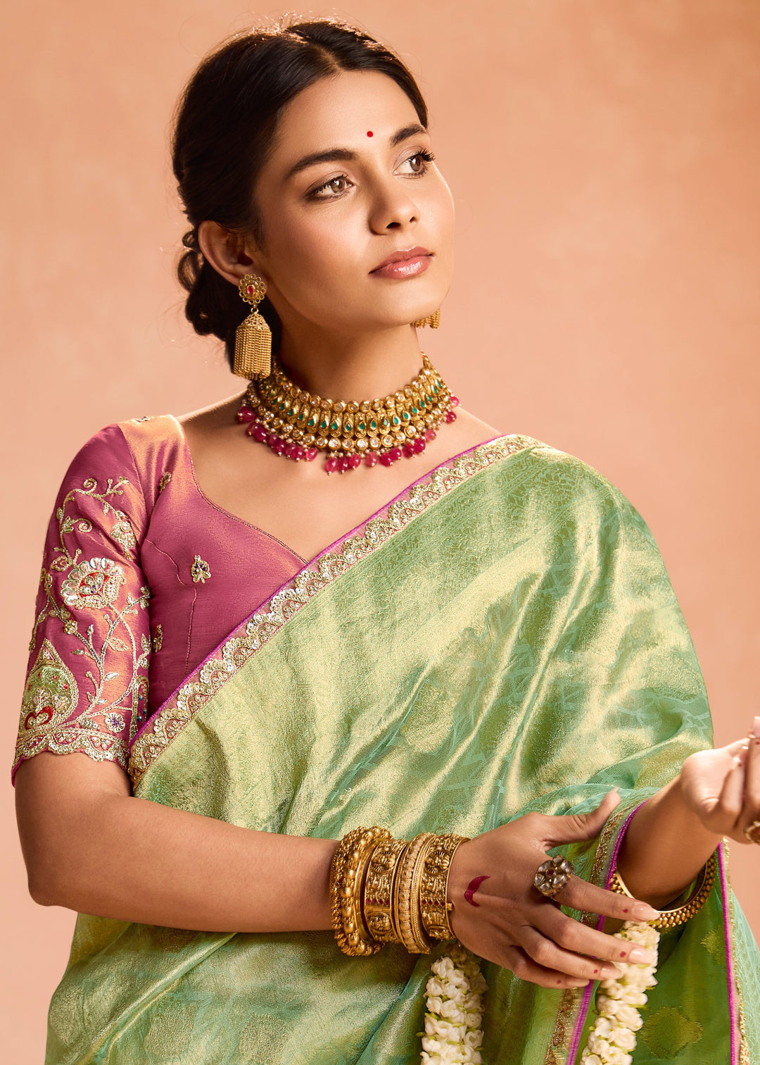 Pastel Green Zari Tissue Silk Saree With Weaving Work And Heavy Embroidery Lace