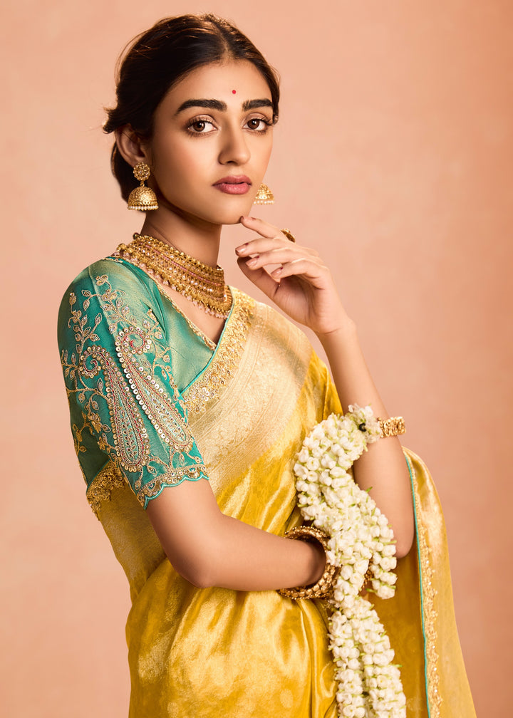 Butter Yellow Zari Tissue Silk Saree With Weaving Work And Heavy Embroidery Lace