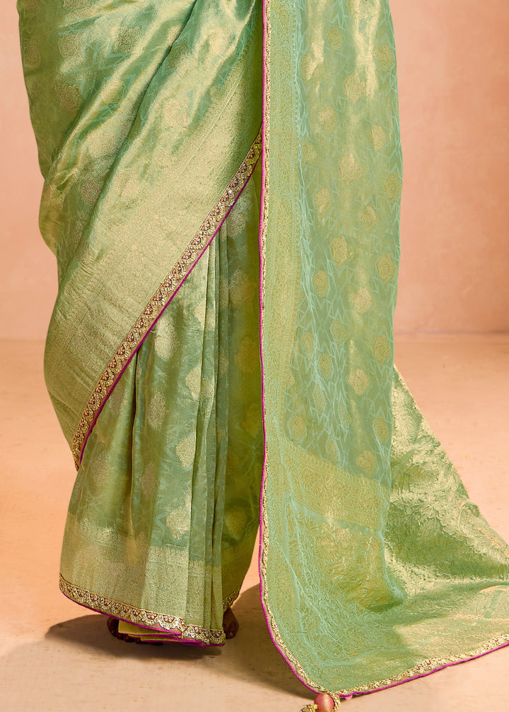 Pastel Green Zari Tissue Silk Saree With Weaving Work And Heavy Embroidery Lace