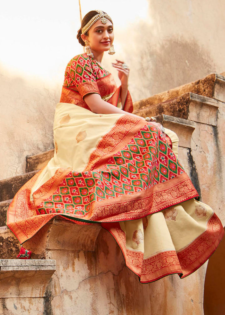 Parchment White Woven Banarasi Patola Silk Saree with Embroidered Blouse