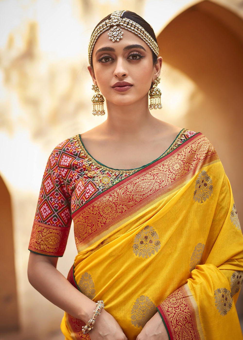 Saffron Yellow Woven Banarasi Patola Silk Saree with Embroidered Blouse