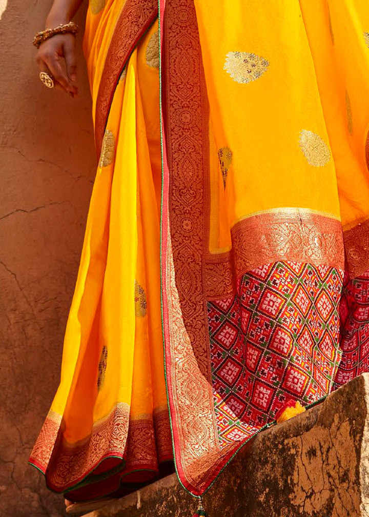 Saffron Yellow Woven Banarasi Patola Silk Saree with Embroidered Blouse