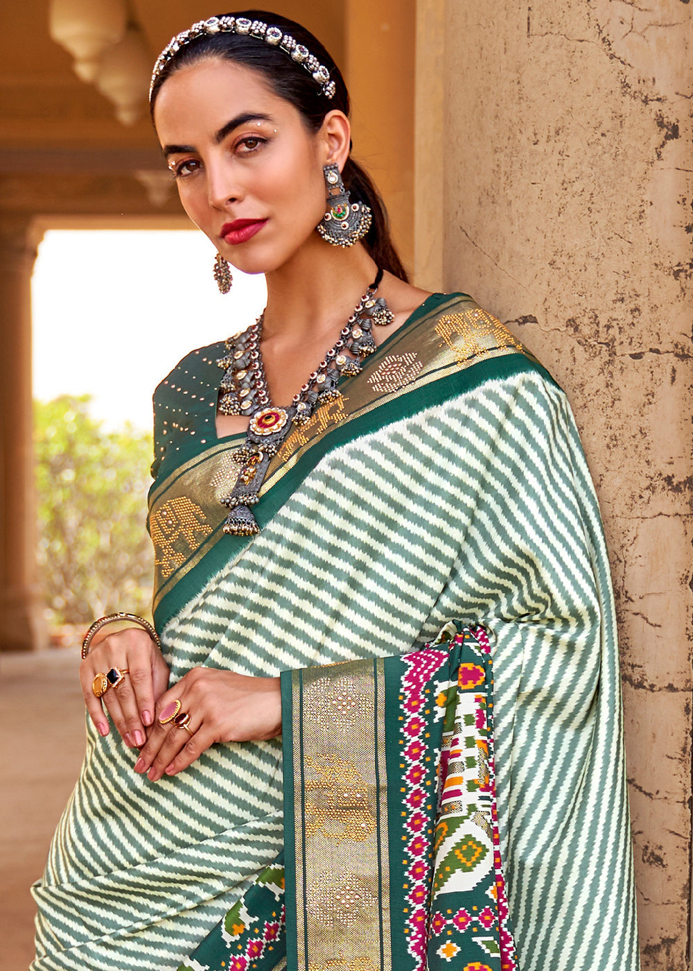 Dark Green Designer Patola Silk Saree with Zari Border & Stone work