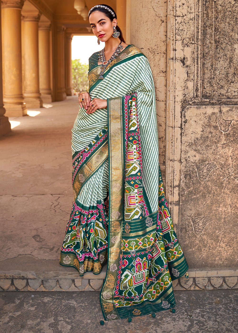 Dark Green Designer Patola Silk Saree with Zari Border & Stone work