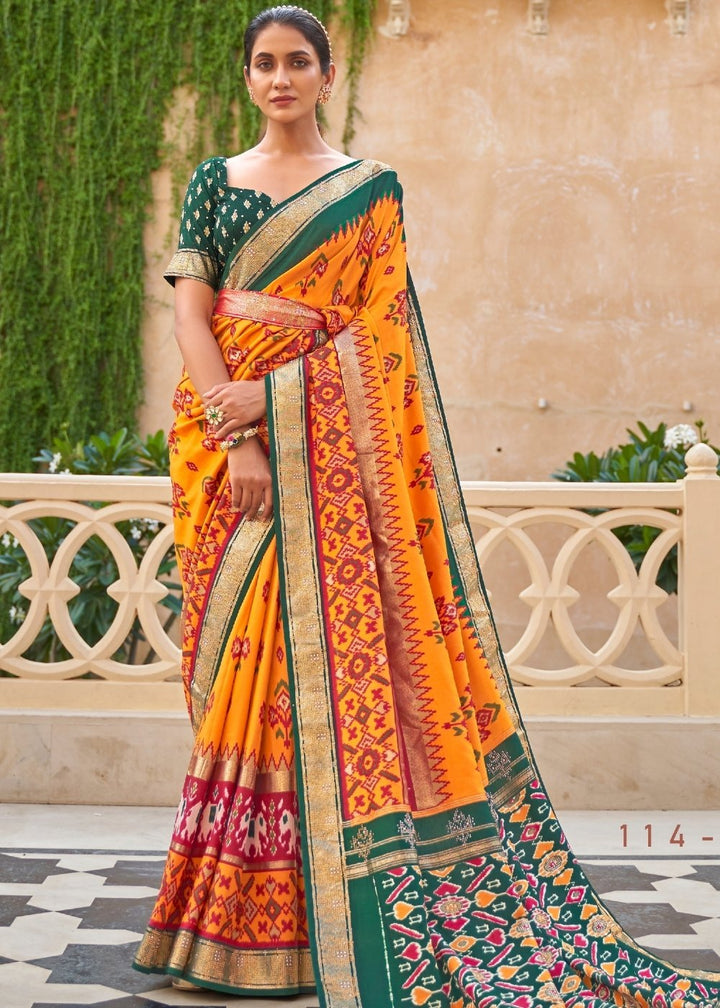 Yellow & Green Patola Silk Saree with Zari Border & Tassels On Pallu