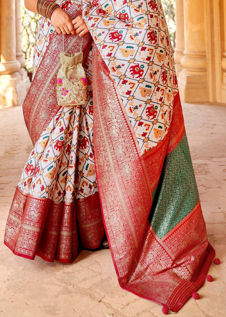 Pearl White Printed Patola Silk Saree with Zari Border & Tassels on Pallu