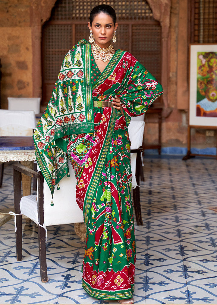 Jungle Green Printed Patola Silk Saree with Zari Border & Tassels on Pallu