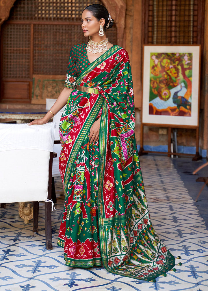 Jungle Green Printed Patola Silk Saree with Zari Border & Tassels on Pallu