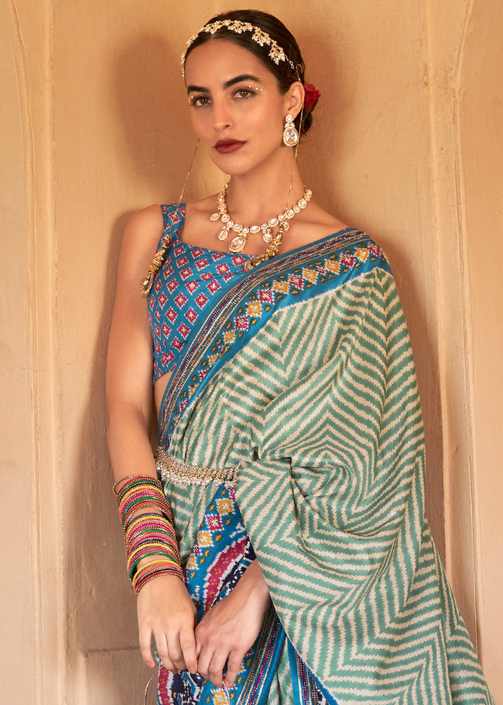 Cerulean Blue Printed Patola Silk Saree with Zari Border & Tassels on Pallu