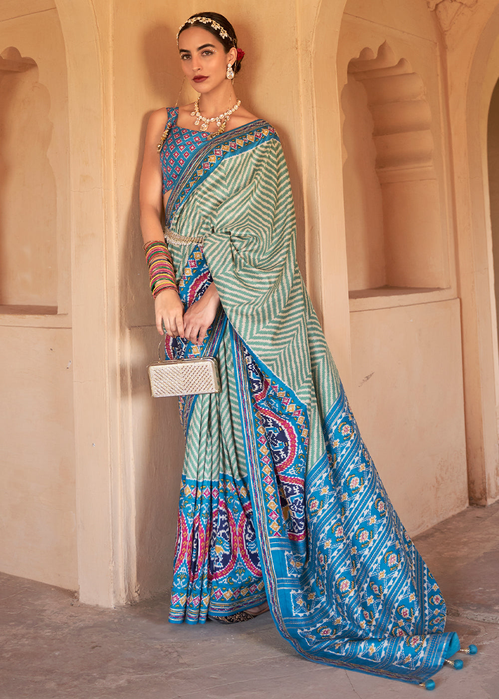 Cerulean Blue Printed Patola Silk Saree with Zari Border & Tassels on Pallu