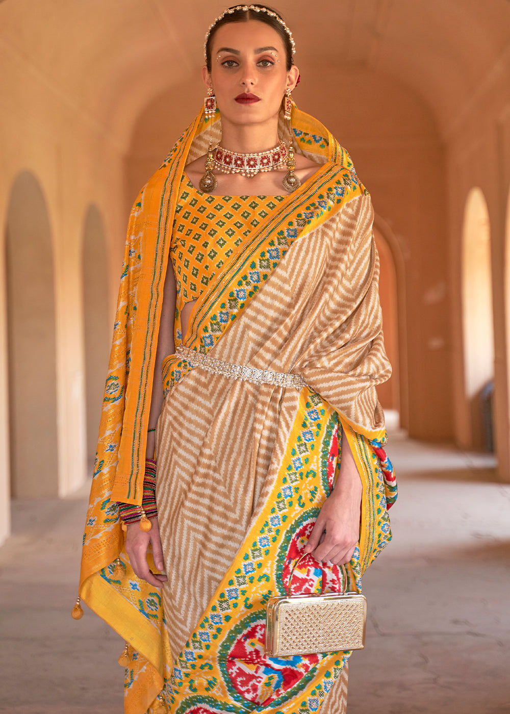 Golden Yellow Printed Patola Silk Saree with Zari Border & Tassels on Pallu