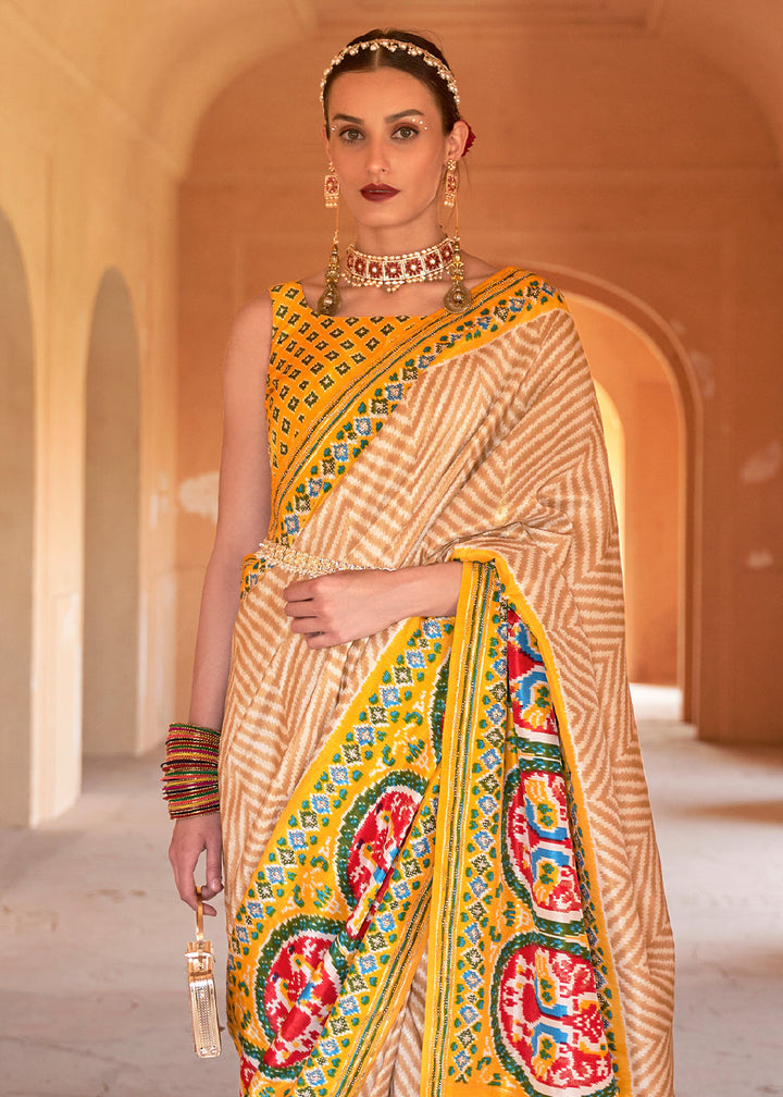 Golden Yellow Printed Patola Silk Saree with Zari Border & Tassels on Pallu