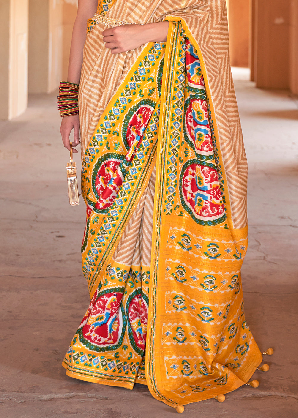 Golden Yellow Printed Patola Silk Saree with Zari Border & Tassels on Pallu