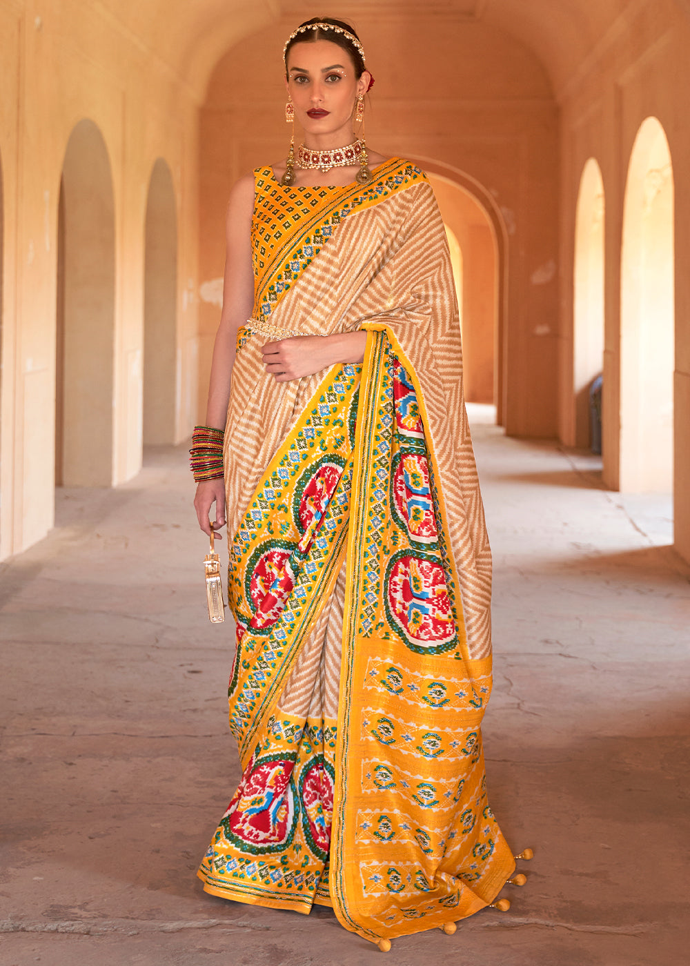 Golden Yellow Printed Patola Silk Saree with Zari Border & Tassels on Pallu