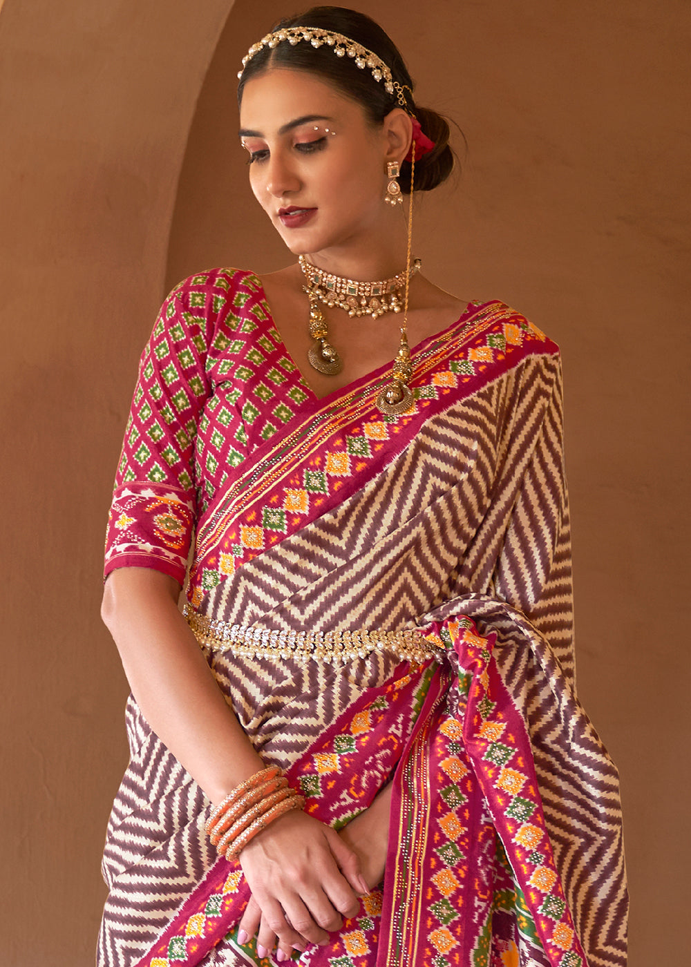 Brown & Pink Printed Patola Silk Saree with Zari Border & Tassels on Pallu