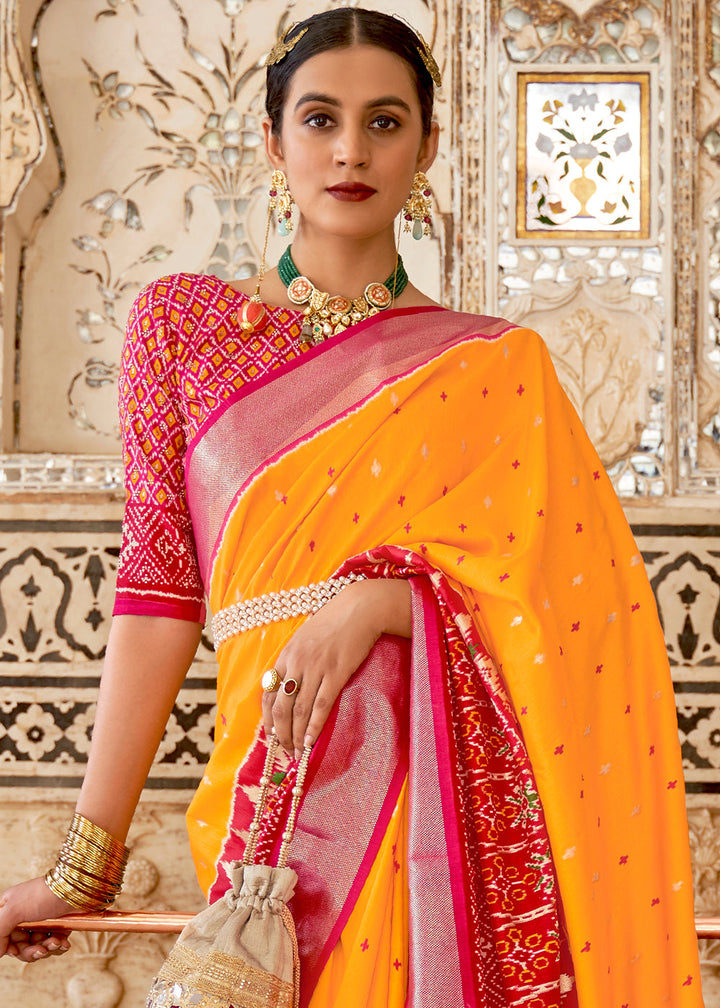 Saffron Yellow Patola Printed Soft Cotton Silk Saree with Zari Border