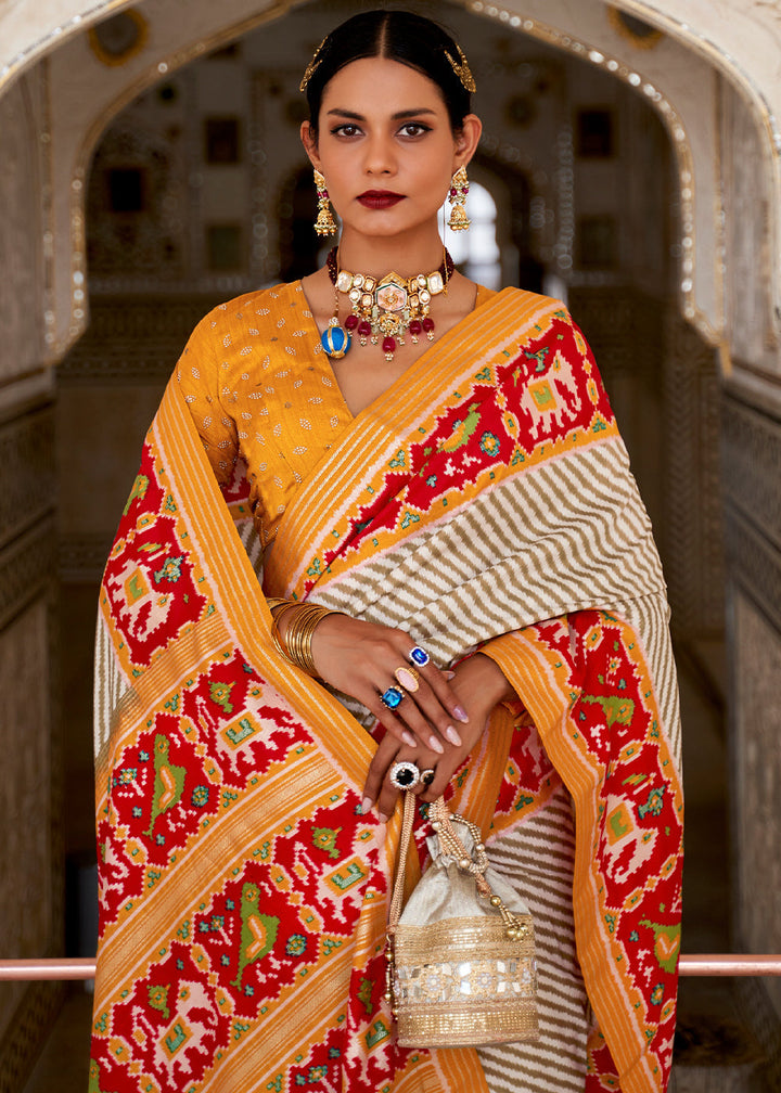 White & Orange Patola Printed Soft Cotton Silk Saree with Zari Border