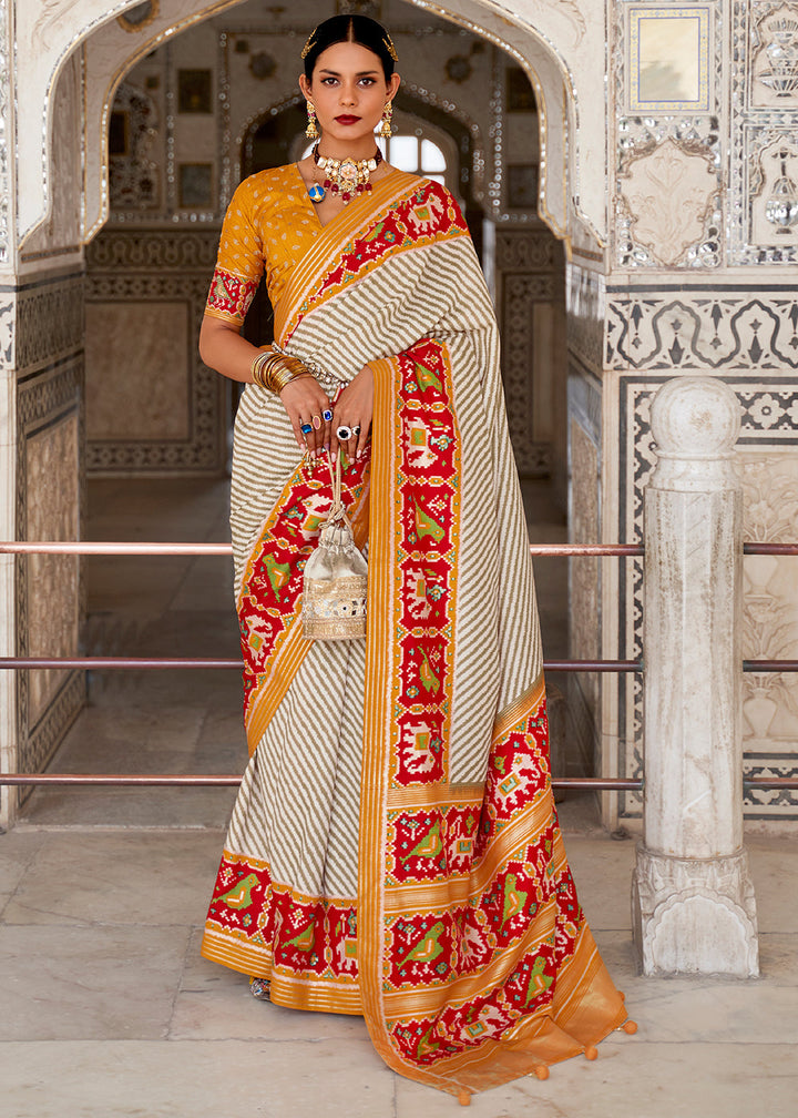 White & Orange Patola Printed Soft Cotton Silk Saree with Zari Border