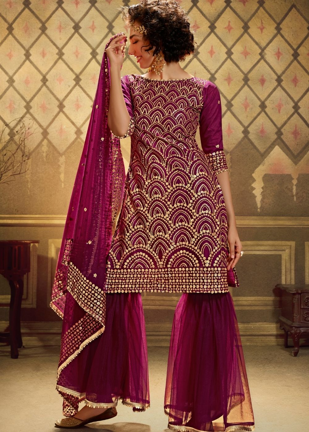 Wine Designer Soft Net Sharara Suit with overall Sequins work