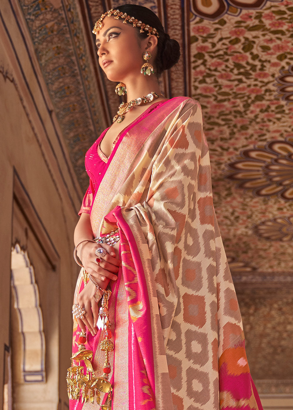 White & Pink Printed Patola Dola Silk Saree with Zari Border