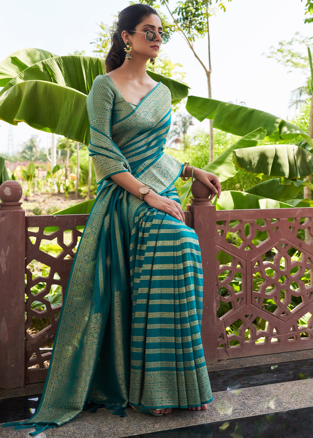 Teal Blue Zari Woven Leheriya Georgette Saree