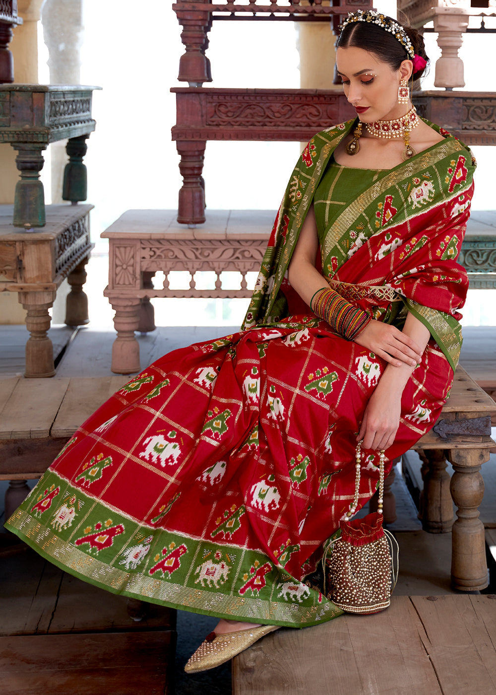 Crimson Red Printed Patola Silk Saree with Zari Border & Tassels on Pallu