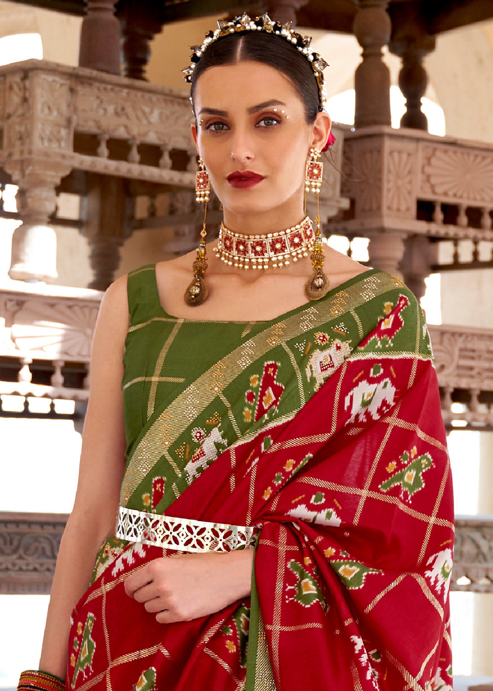 Crimson Red Printed Patola Silk Saree with Zari Border & Tassels on Pallu