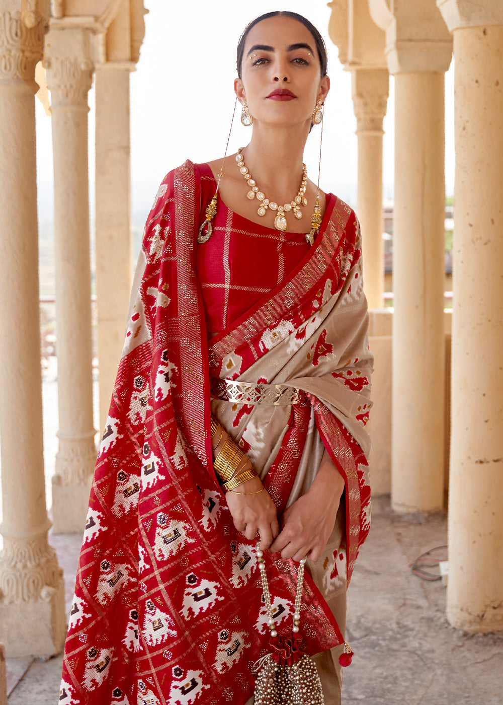 Oat Brown Printed Patola Silk Saree with Zari Border & Tassels on Pallu