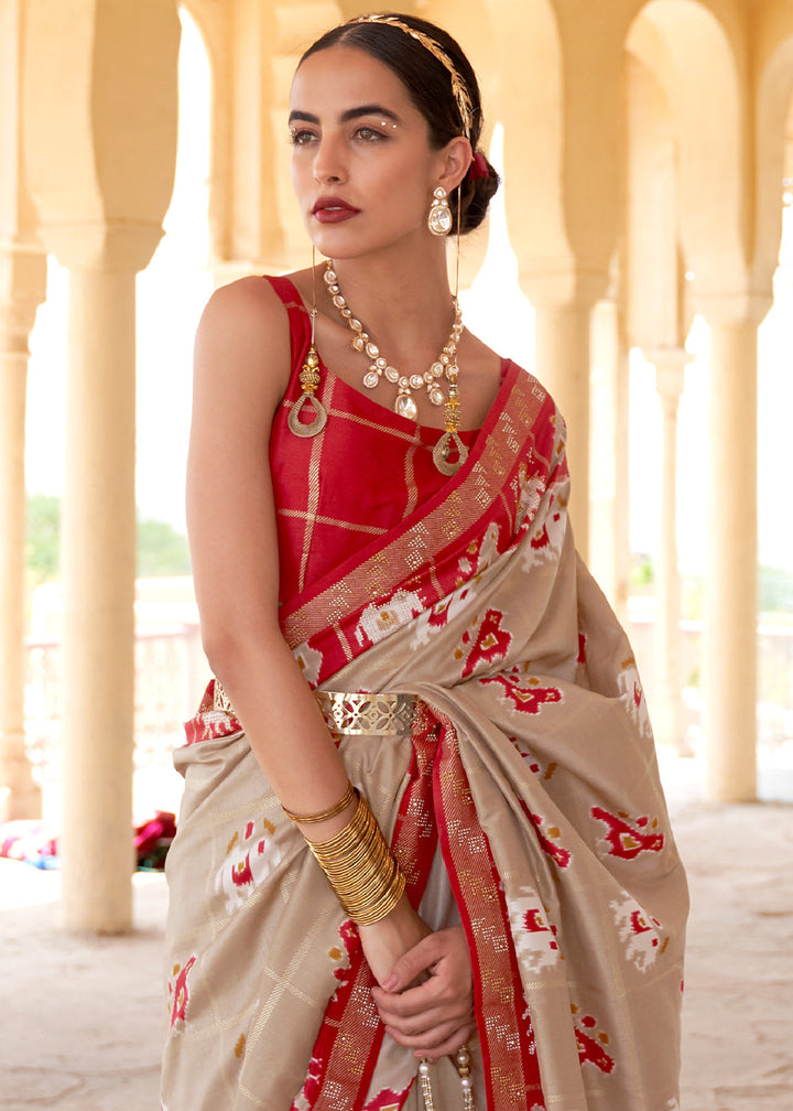 Oat Brown Printed Patola Silk Saree with Zari Border & Tassels on Pallu