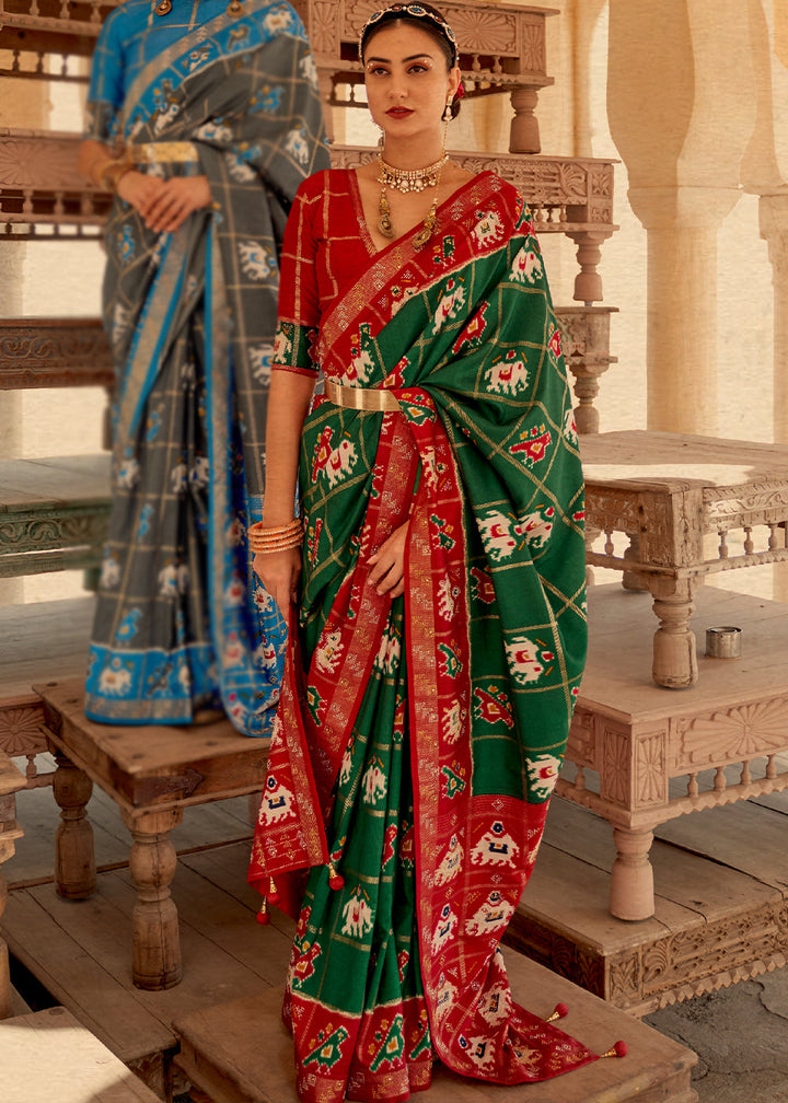 Bottle Green Printed Patola Silk Saree with Zari Border & Tassels on Pallu