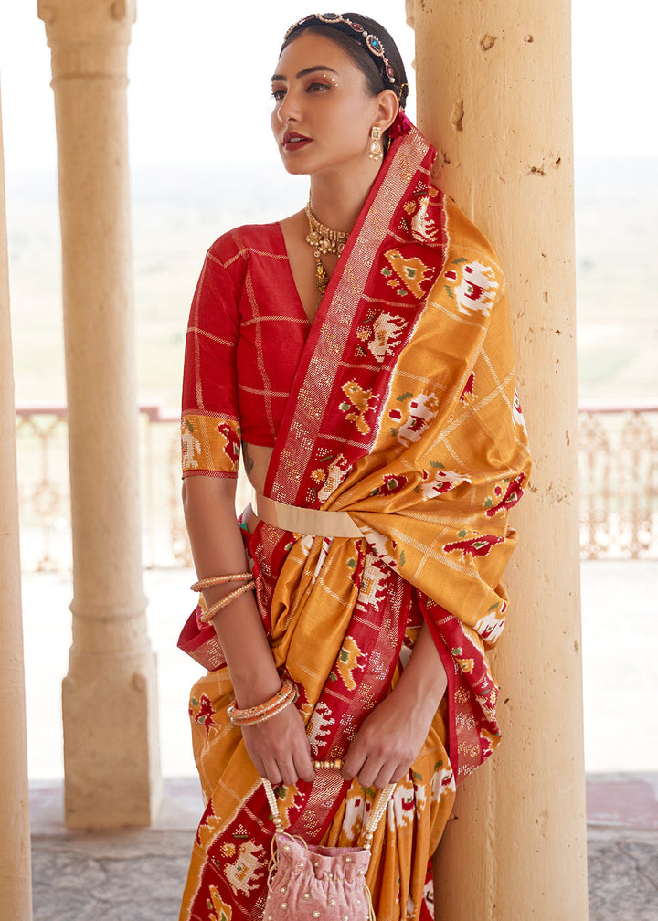 Honey Orange Printed Patola Silk Saree with Zari Border & Tassels on Pallu