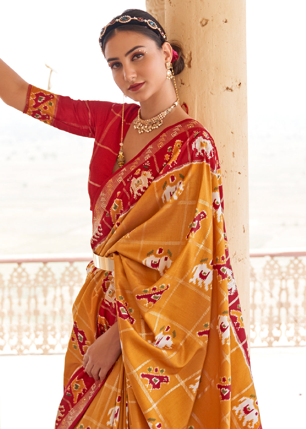 Honey Orange Printed Patola Silk Saree with Zari Border & Tassels on Pallu