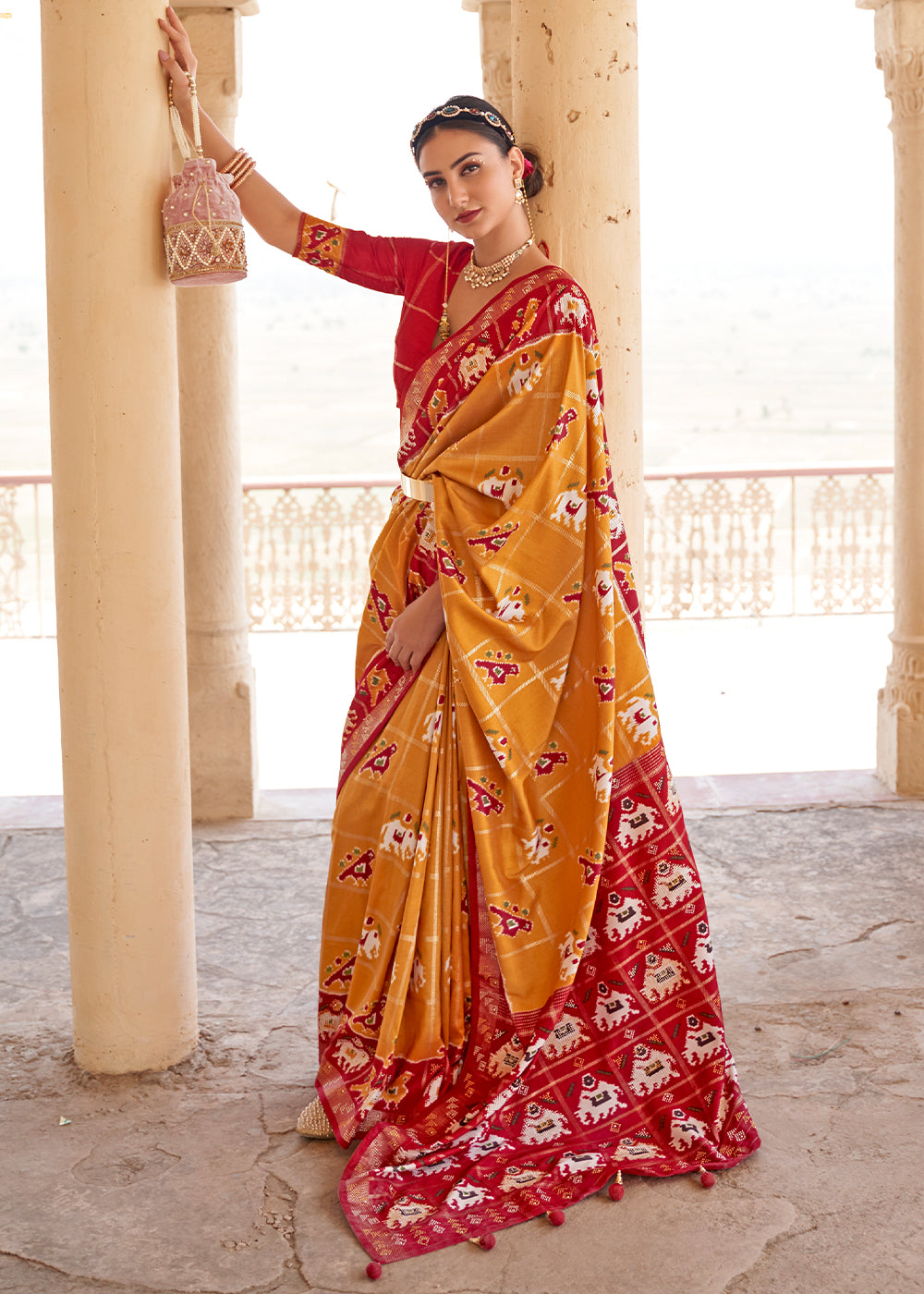 Honey Orange Printed Patola Silk Saree with Zari Border & Tassels on Pallu