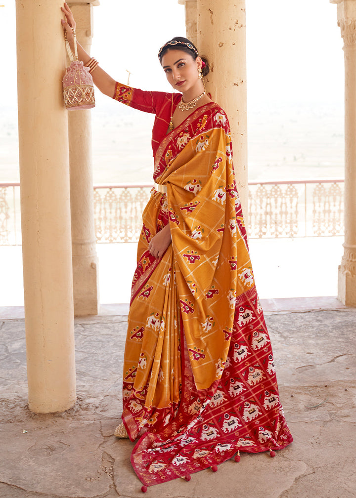 Honey Orange Printed Patola Silk Saree with Zari Border & Tassels on Pallu